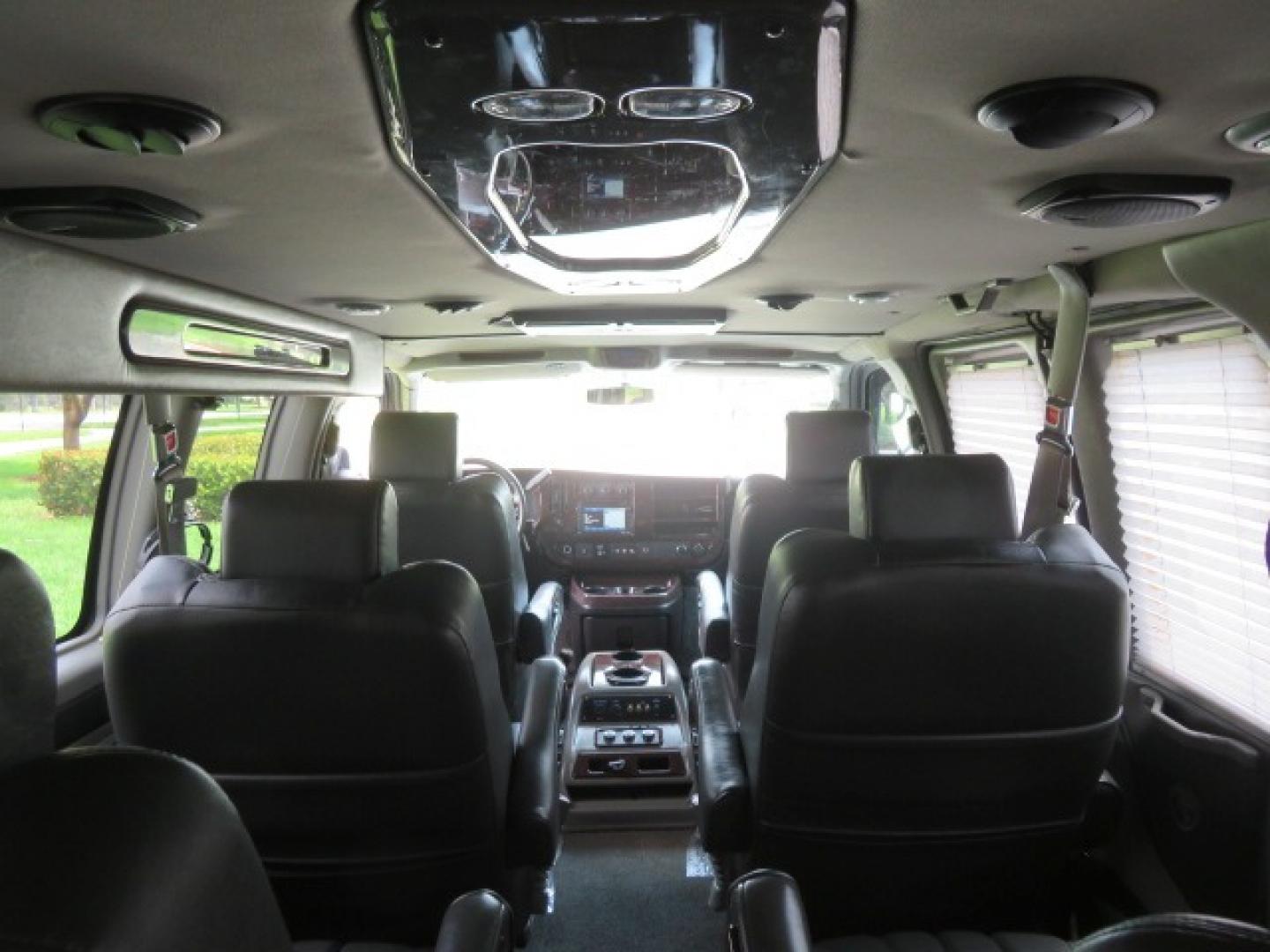 2014 Chevrolet Express (1GBWGLCG3E1) , located at 4301 Oak Circle #19, Boca Raton, FL, 33431, (954) 561-2499, 26.388861, -80.084038 - You are looking at a Rare 2014 Chevy Express 2500 Quigley 4x4 Four Wheel Drive Explorer Limited SE 9 Passenger Conversion Van with: 107K Original Miles, 6 Captain Chairs, Rear Power Folding Bench Seat Bed, Center Consoler Cooler, Front PPF (Paint Protection Film) Explorer Limited Conversion Througho - Photo#58